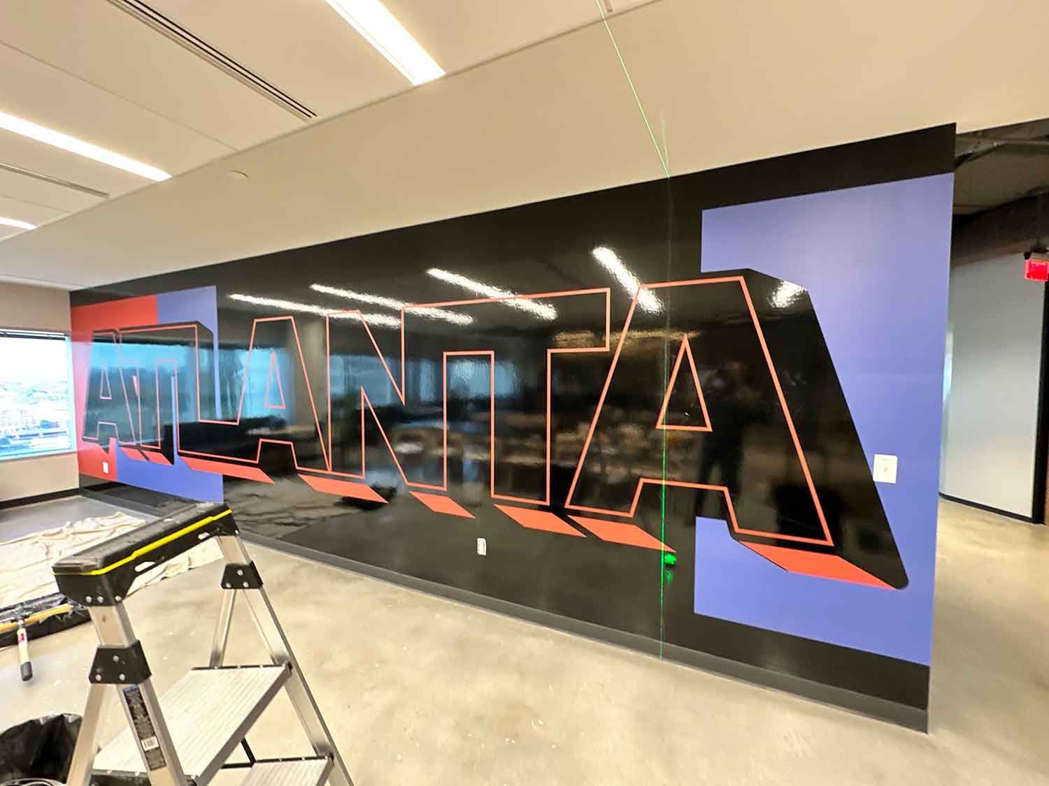 VisualPro created wall graphics and acrylic signage for Service Titan.