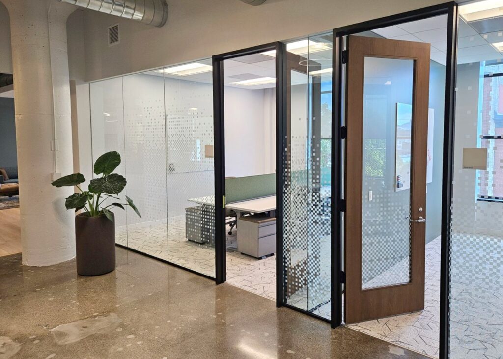 The custom window film adds a powerful design element to this office space,