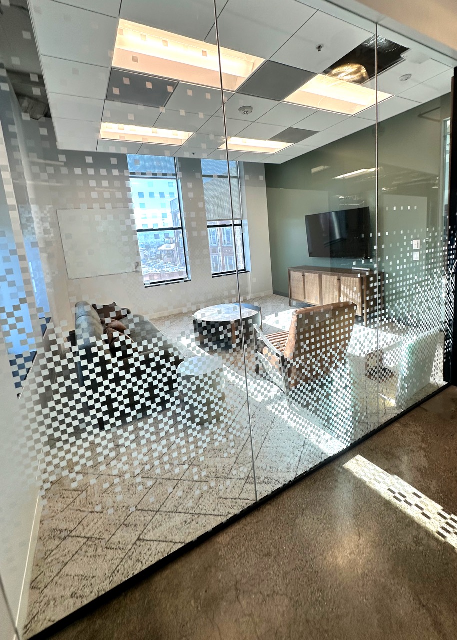 Pixelated custom design added to window film. Designed and installed by VisualPro.