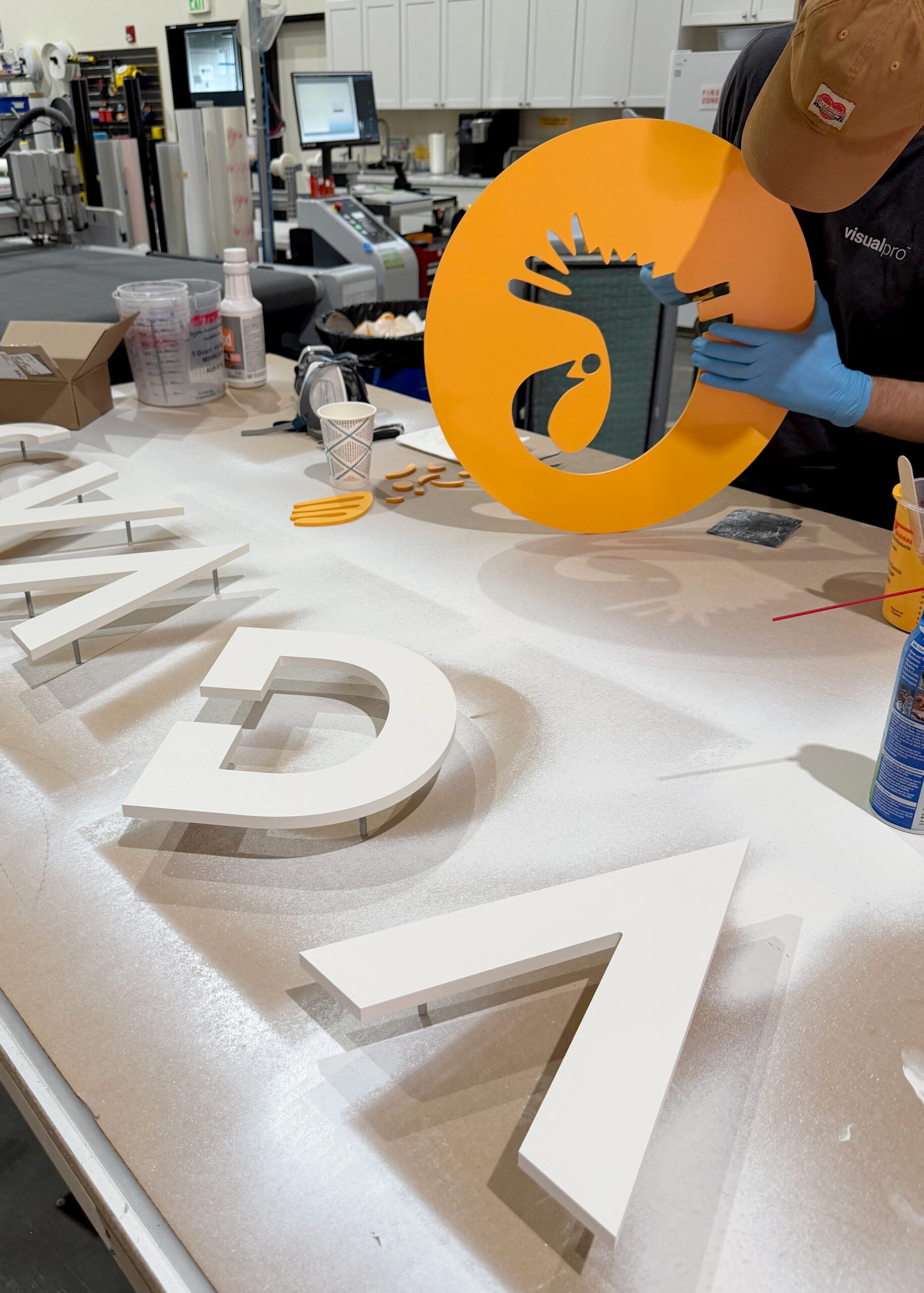 Standoff acrylic logo signage fabricated in-house.