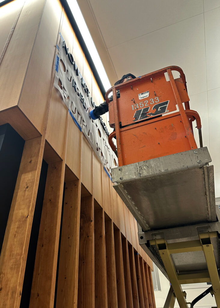 Installing the custom lettering.